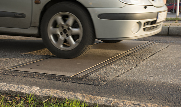 Efficient Traffic Control: Speed Bumps & Flow Plates